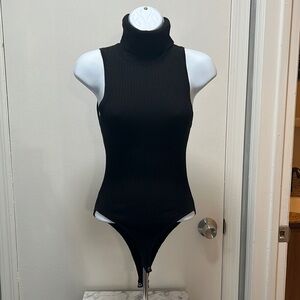 Black ribbed turtle neck body suit